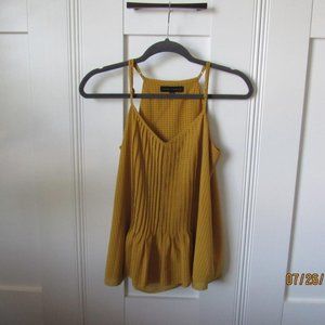 Mustard color tank top.